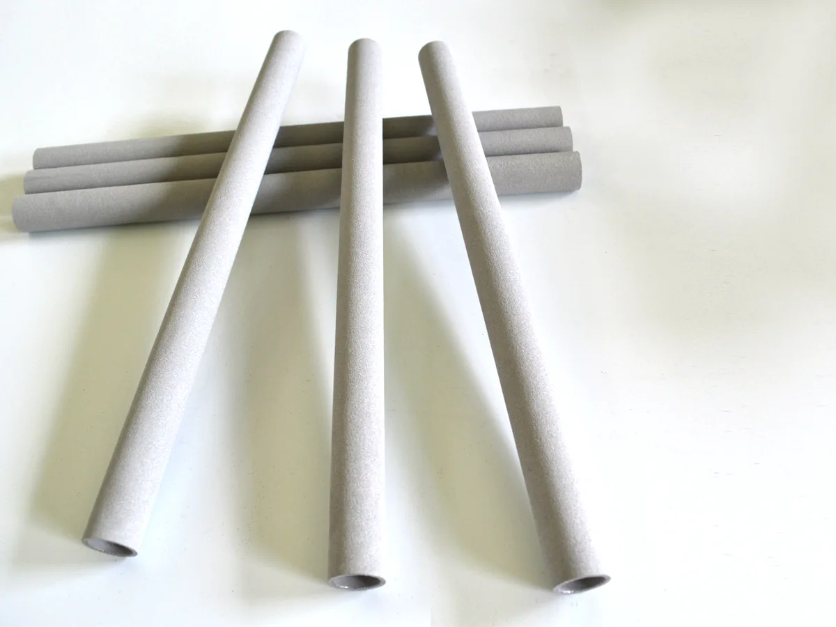 Sintered porous metal tubes at multiple angles