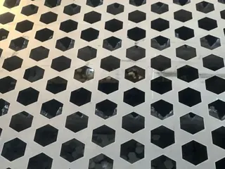 Titanium perforated sheet, hexagonal holes close-up